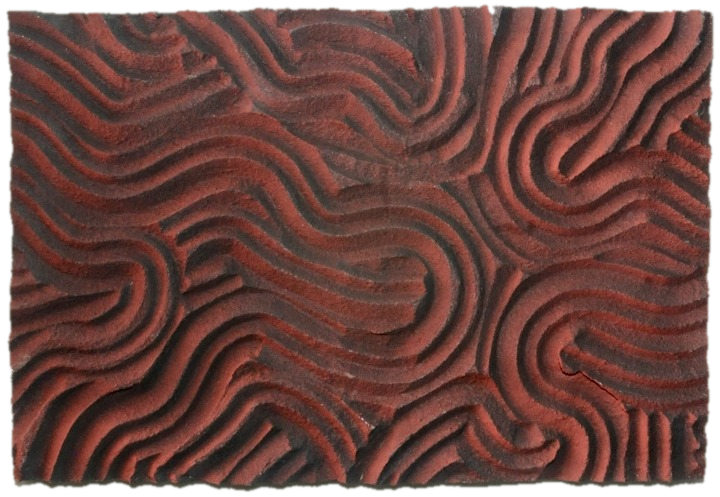 Garnet, sculptural relief in deep wine red with slow, swirling carved contours, cut out along its carved edges
